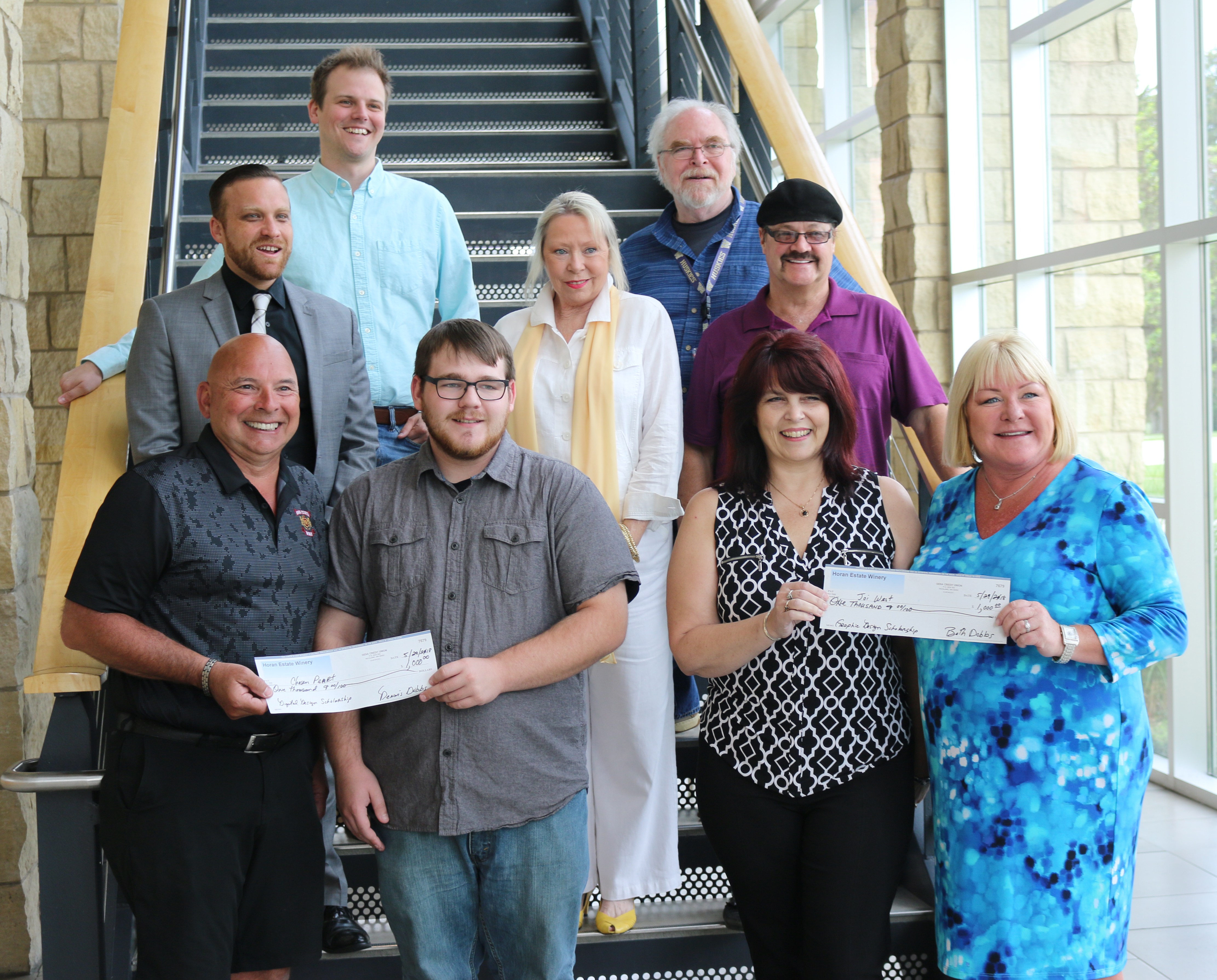 Scholarship recipients stand with donors and instructors