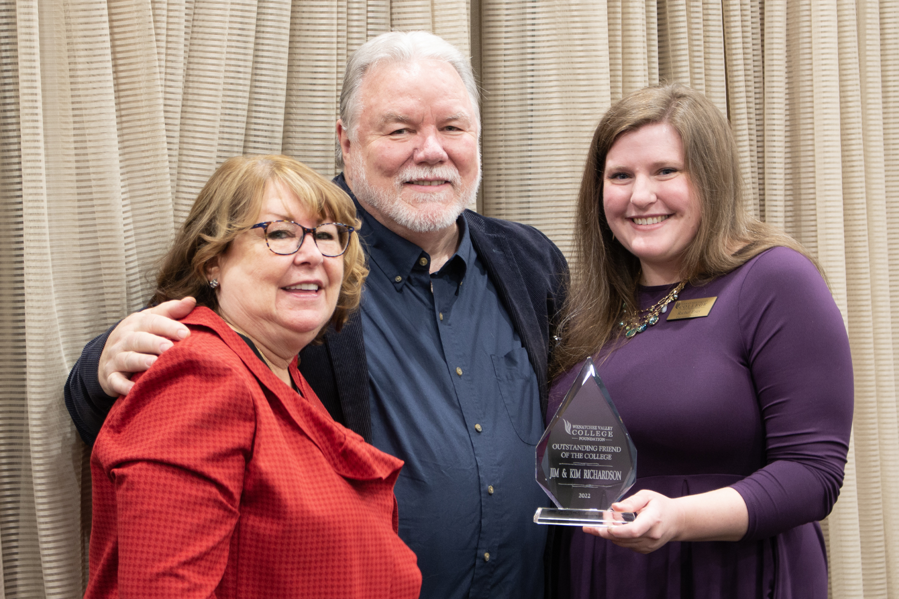 Kim Richardson, Jim Richardson and Rachel Evey holding Outstanding Friends of the College Award