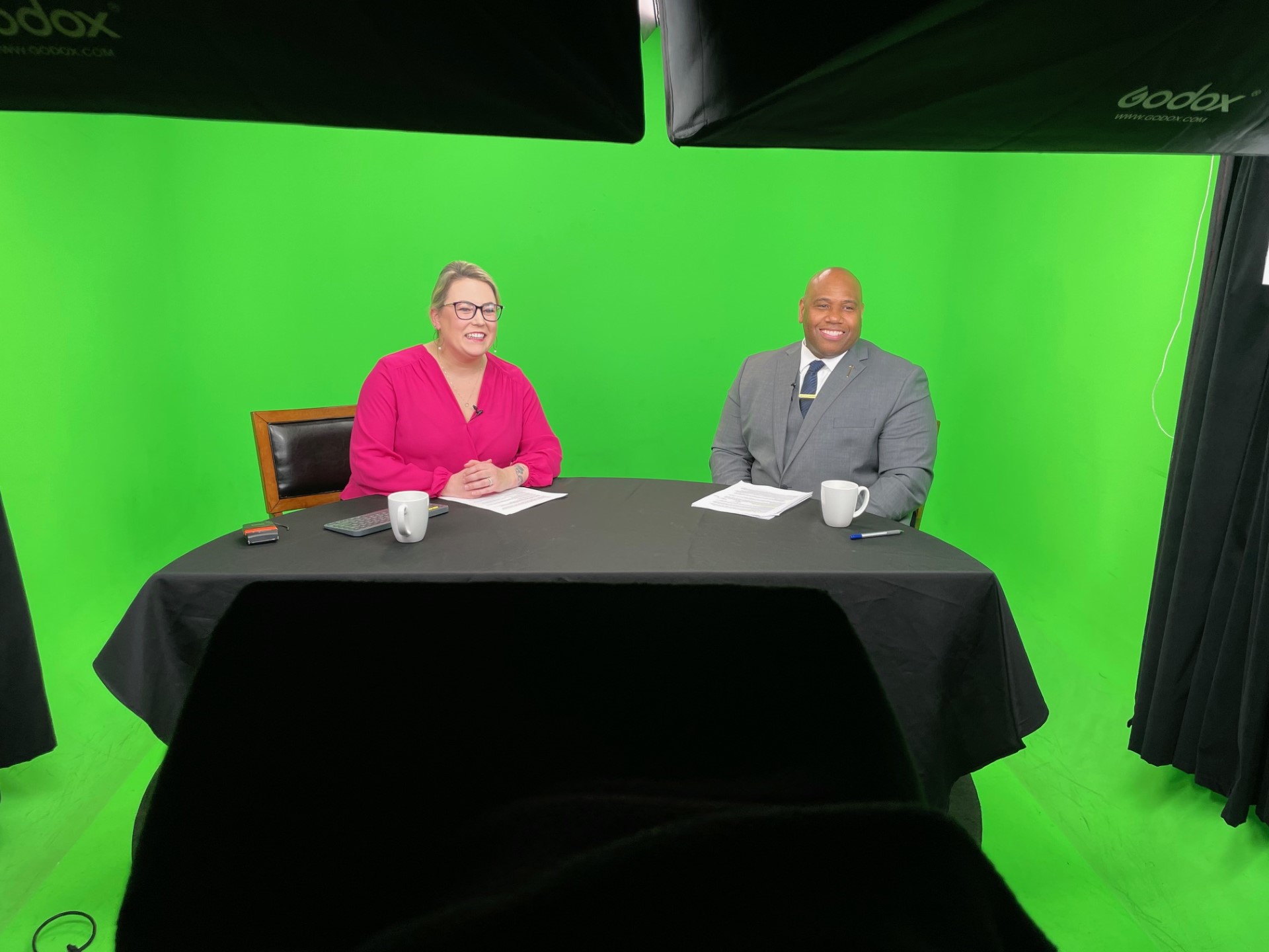 Faimous Harrison in front of a green screen