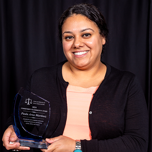 Paula Arno Martinez holding award