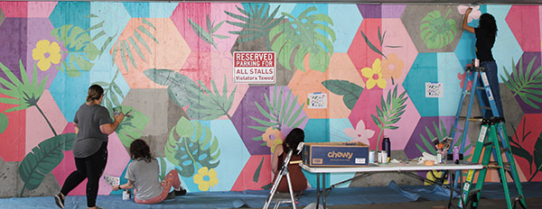 ART 141 students working on a mural project