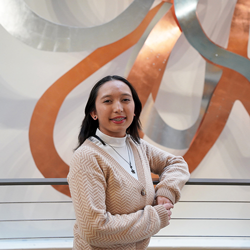 WVC student Hailey Hopkins stands next to a railing.