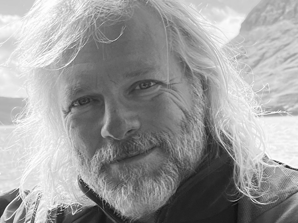 A black-and-white portrait of author Jonathan Johnson